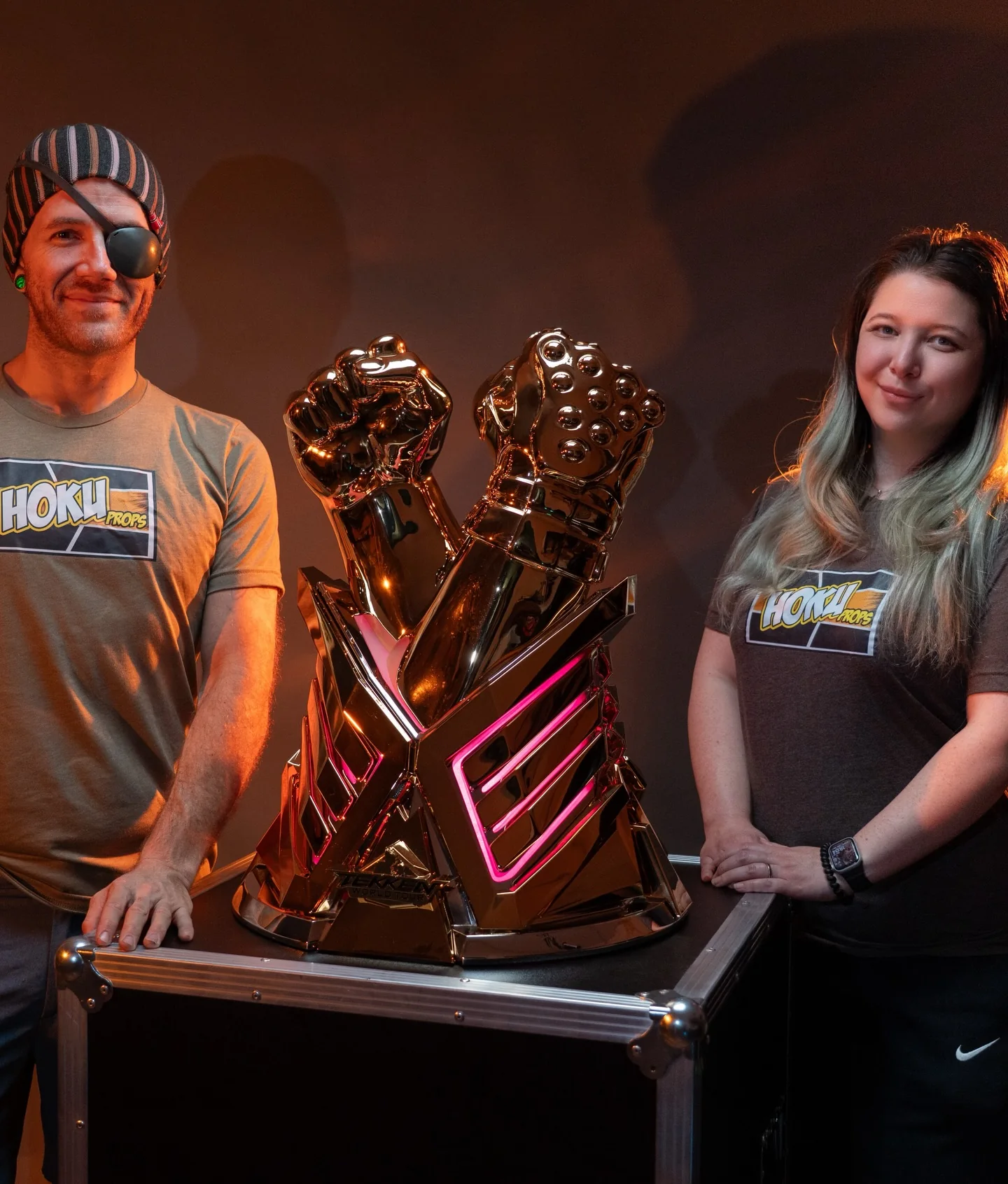Chad Van Wye and Samantha Rumbaugh of Hoku Props with the TEKKEN World Tour 2025 trophy